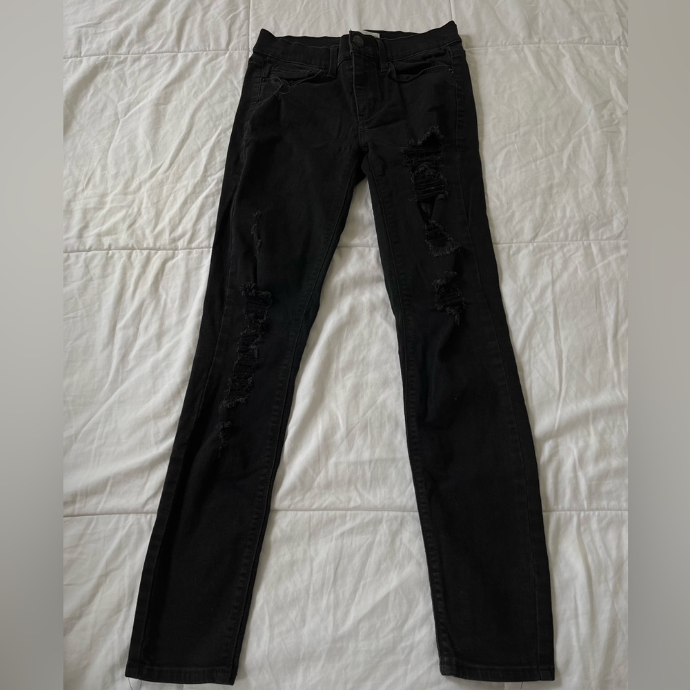 Black ripped jeans, in good condition, low rise